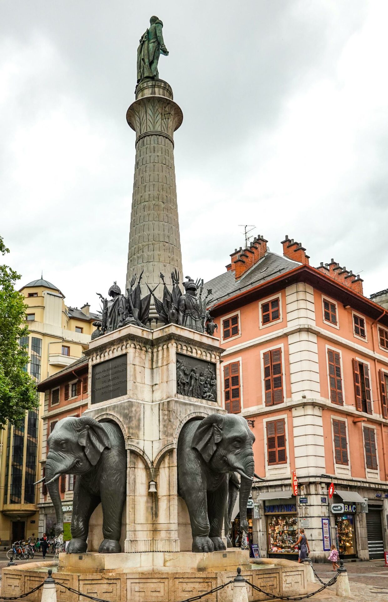 Historic monument with elephant sculptures in Chambéry, France, showcasing cultural heritage.