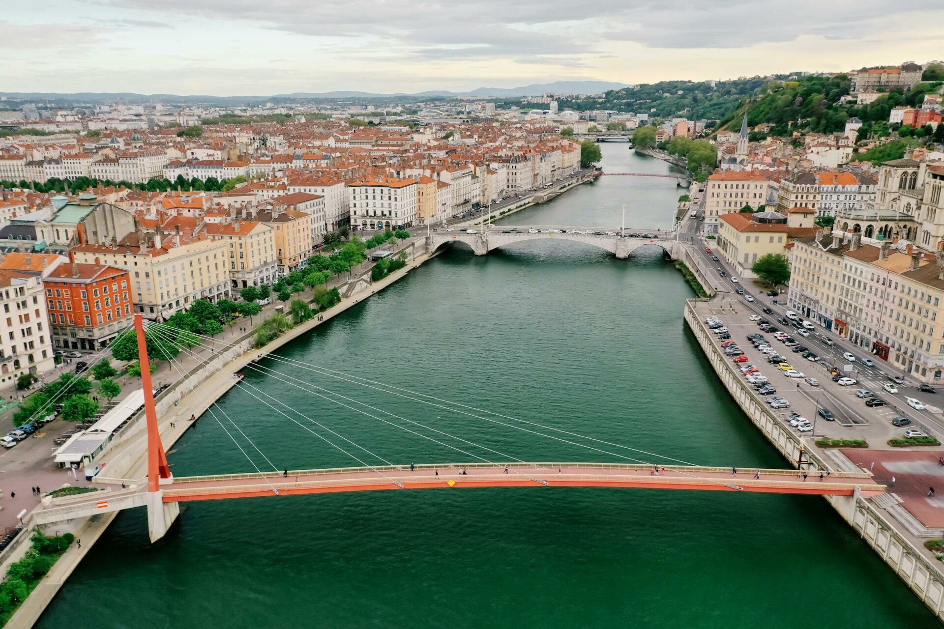 A scenic aerial view of Lyon, France featuring Saone River and iconic bridges.